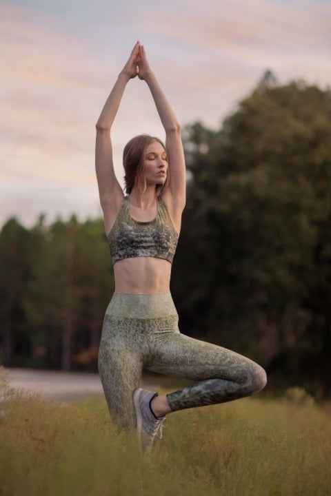 Yoga model poses in Nature Beyond Threads yoga leggings and sports in Meadows print. 